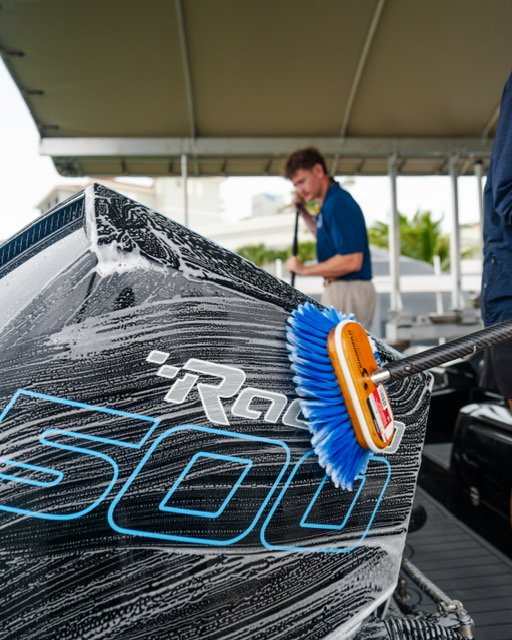 Close-up of a Mercury Racing 500 outboard being foam-brushed in Naples, Florida